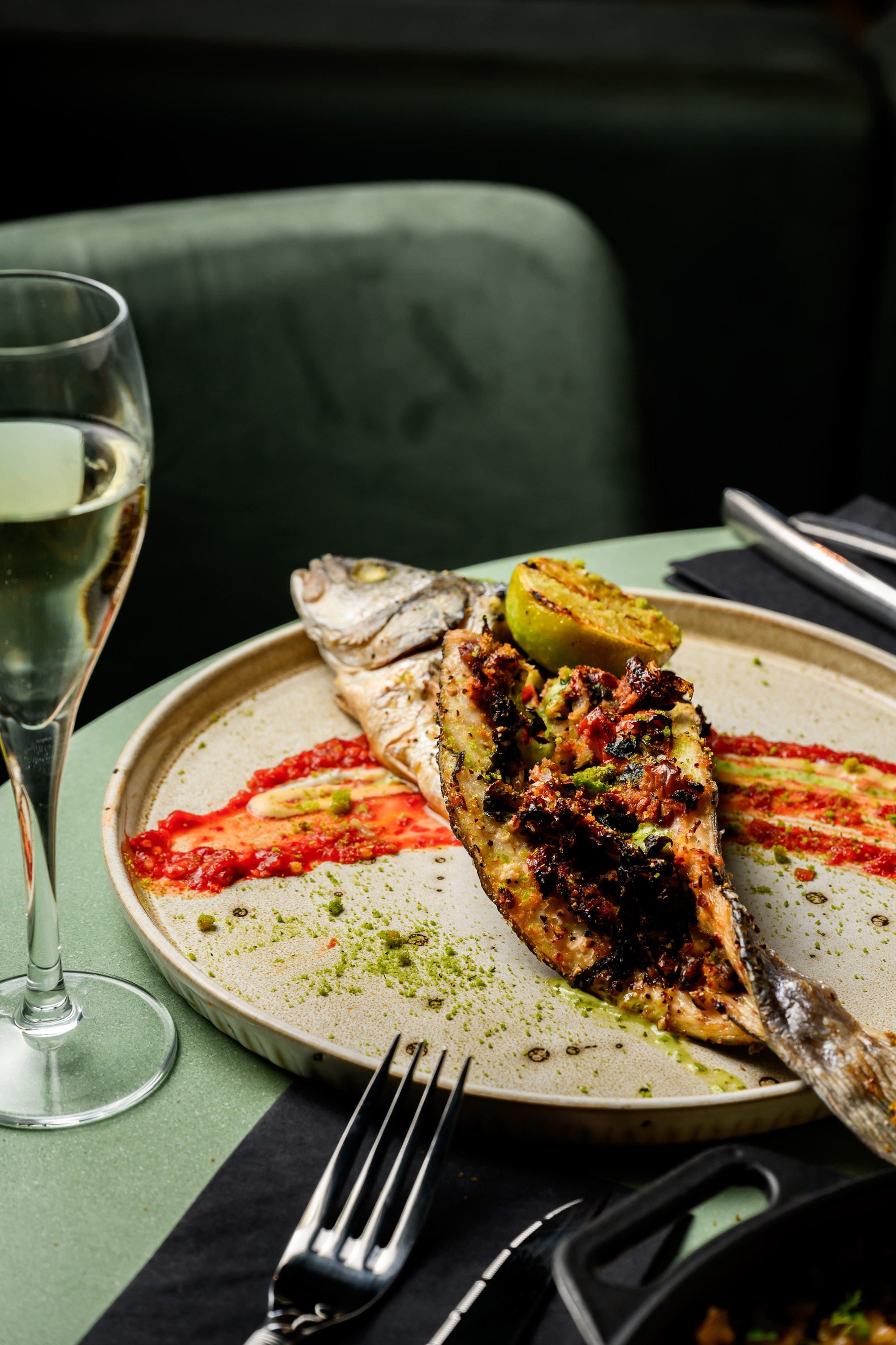 Grilled whole fish plated at Tramonto