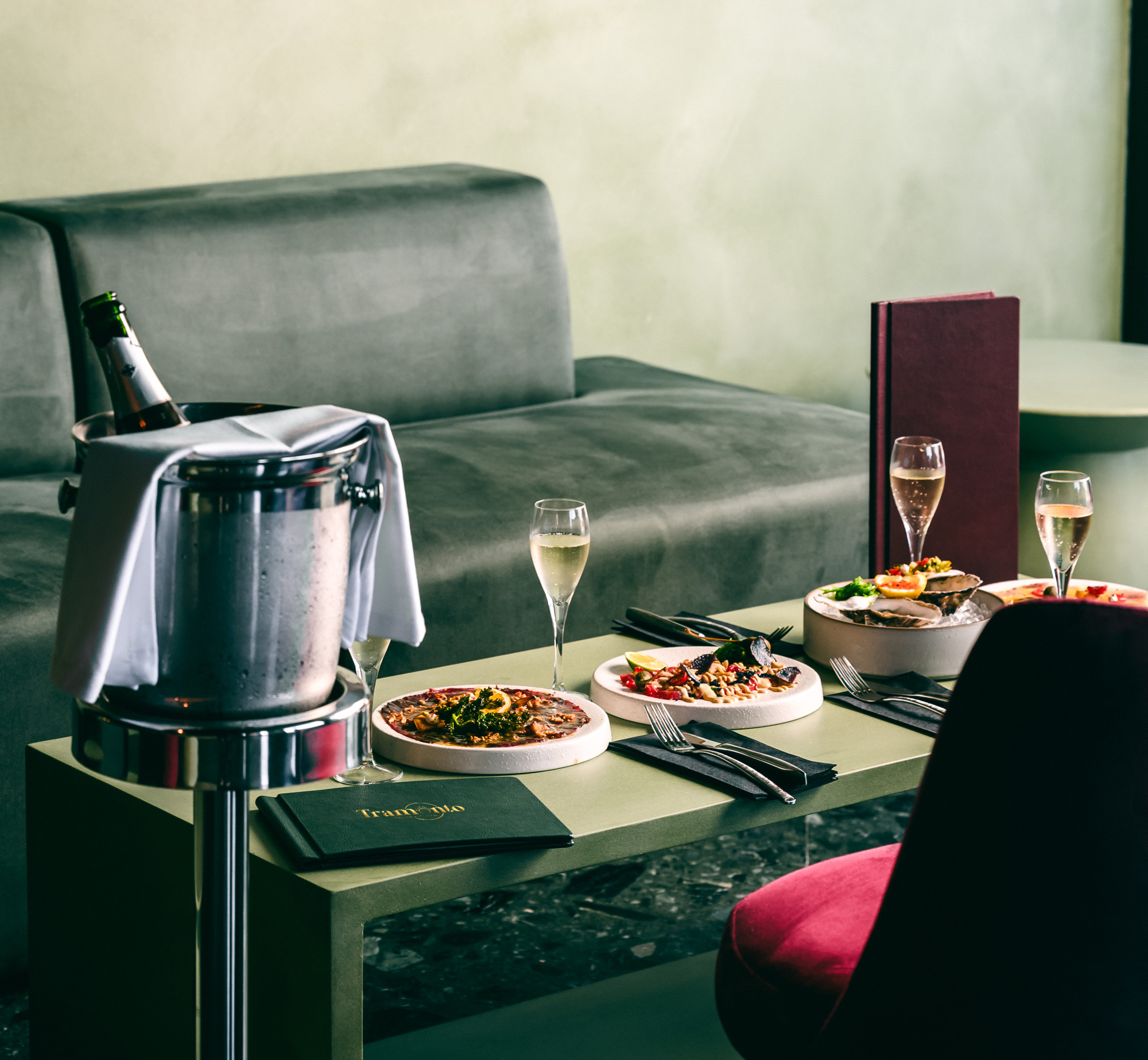 The atmosphere at Tramonto — table set with champagne and small plates